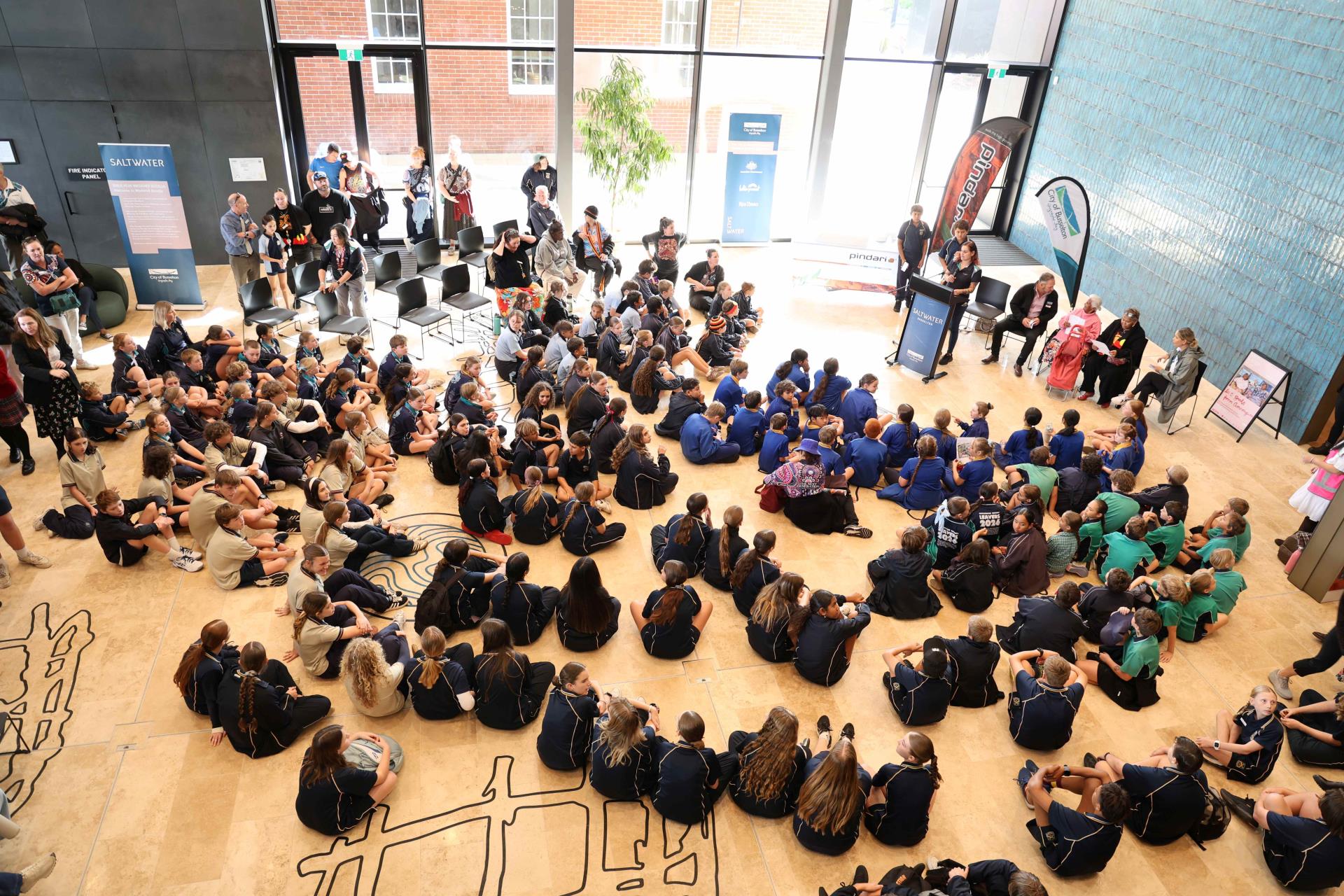 Students gathered at Saltwater Busselton for a Reconciliation Week event featuring speakers and cultural presentations.